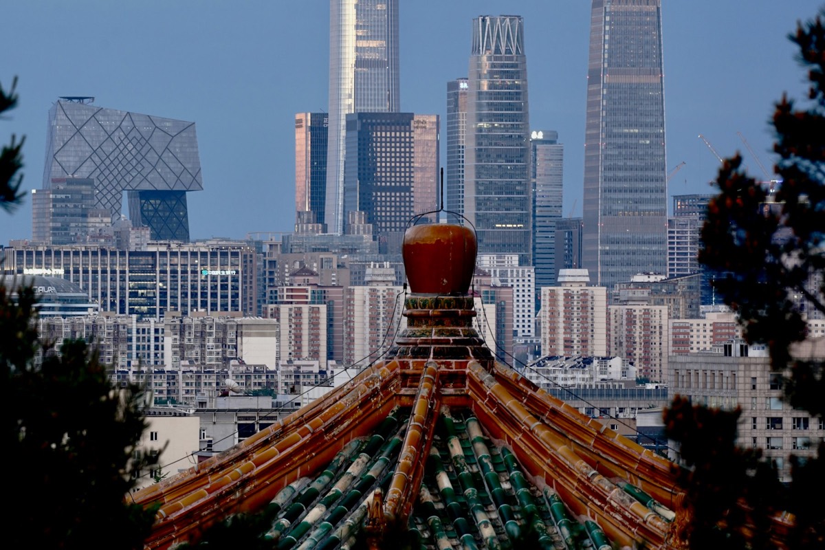 Beijing skyline framed by traditional roof details
